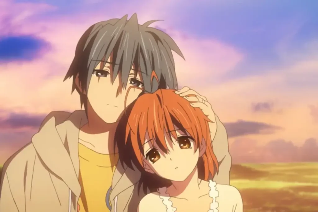 Boy gently holds a red-haired girl close as the sun sets behind them.