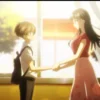 Anna Yamada and Kyotaro Ichikawa hold hands by the classroom window as the sunset glows warmly.