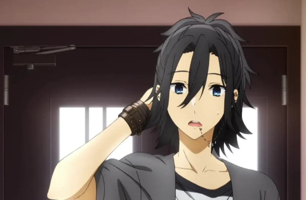 zumi Miyamura with long black hair and blue eyes, looking surprised while scratching his head.