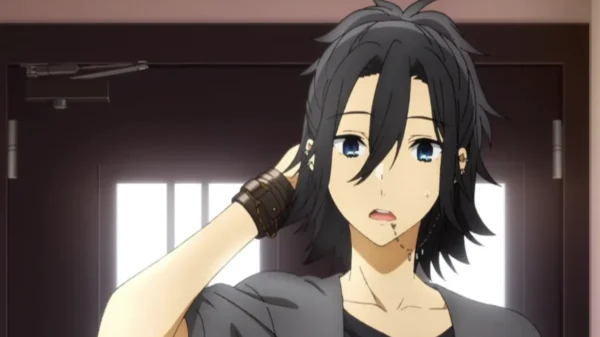 zumi Miyamura with long black hair and blue eyes, looking surprised while scratching his head.